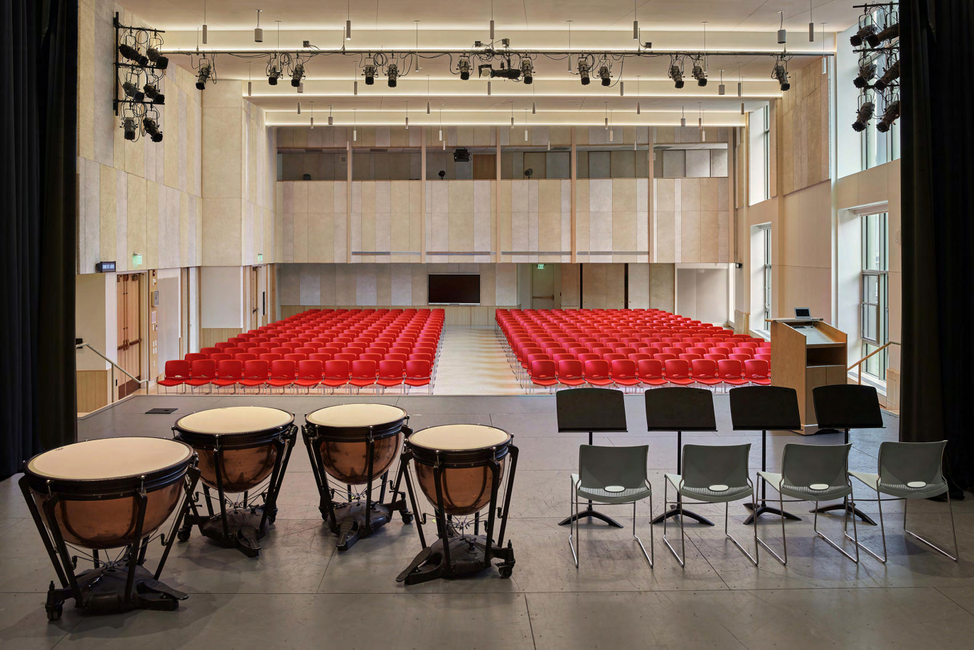 The Intensively Used Flat Floor Multi-Purpose Auditorium Hosting A Variety of Events From Performances to Fairs and Exhibits