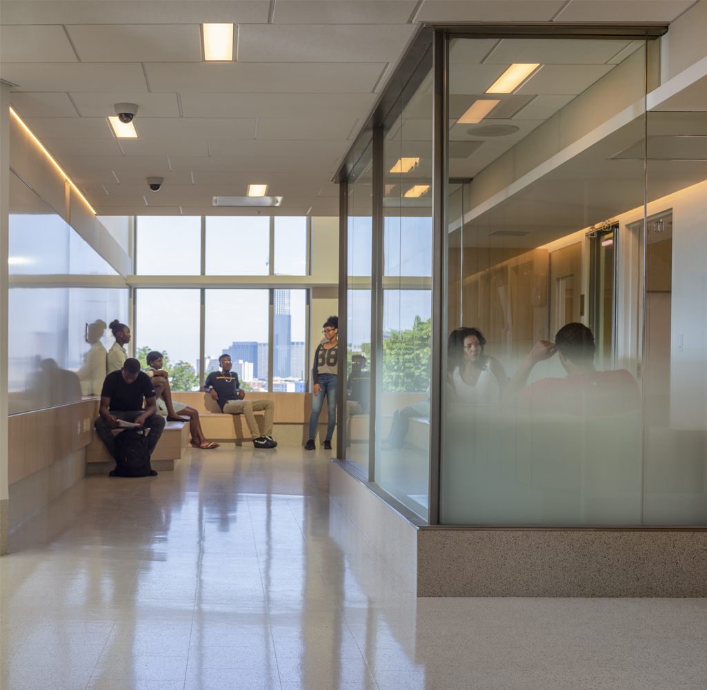 Glazed teacher offices & occupied corridors