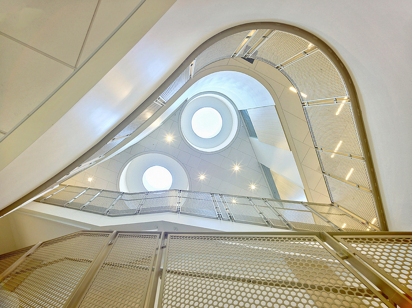 Looking up staircase at ceiling